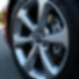 Close-up of a lug nut on a 2016 Ford Fusion wheel