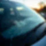 A close-up of a damaged windshield highlighting cracks and chips