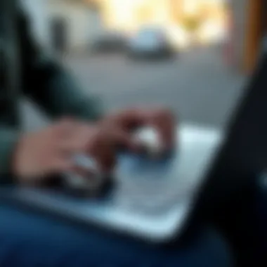 A person using a laptop to register a vehicle online